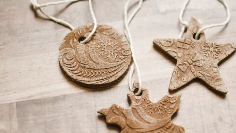 embossed cinnamon dough ornaments laying on counter