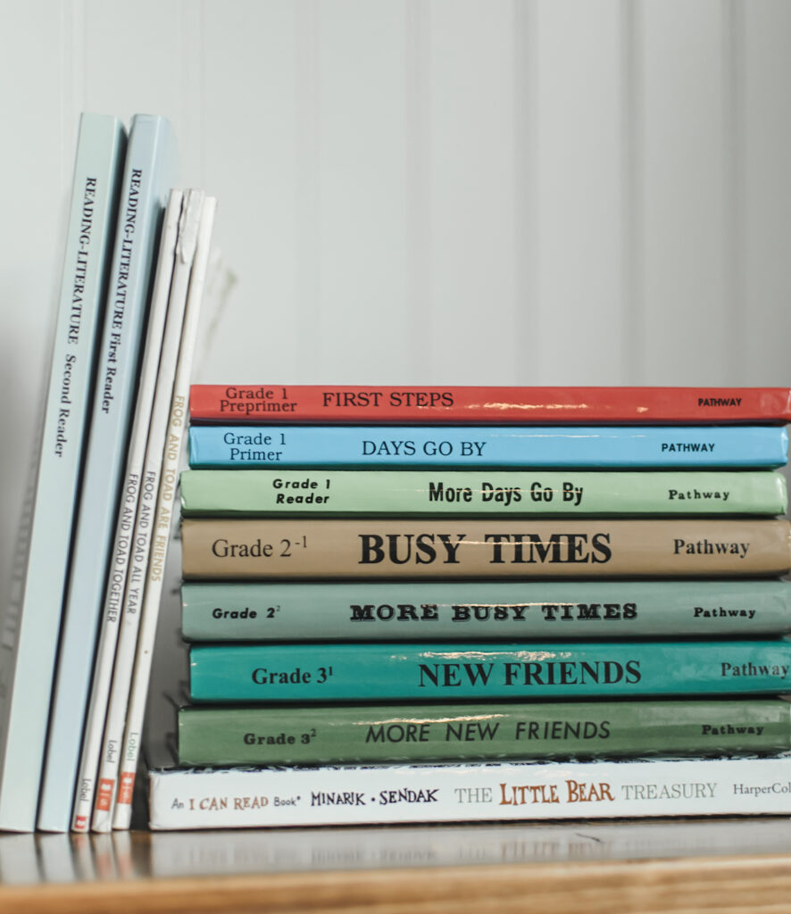 stack of pathway readers next to our choices of best early reader books