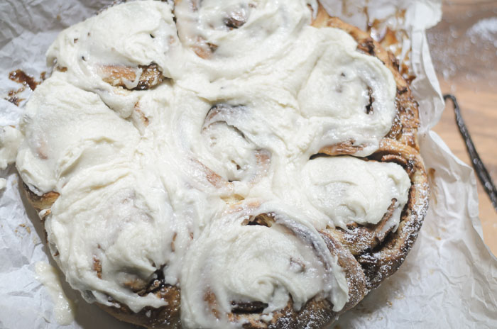 frosted and topped with powdered sugar sourdough apple cinnamon rolls
